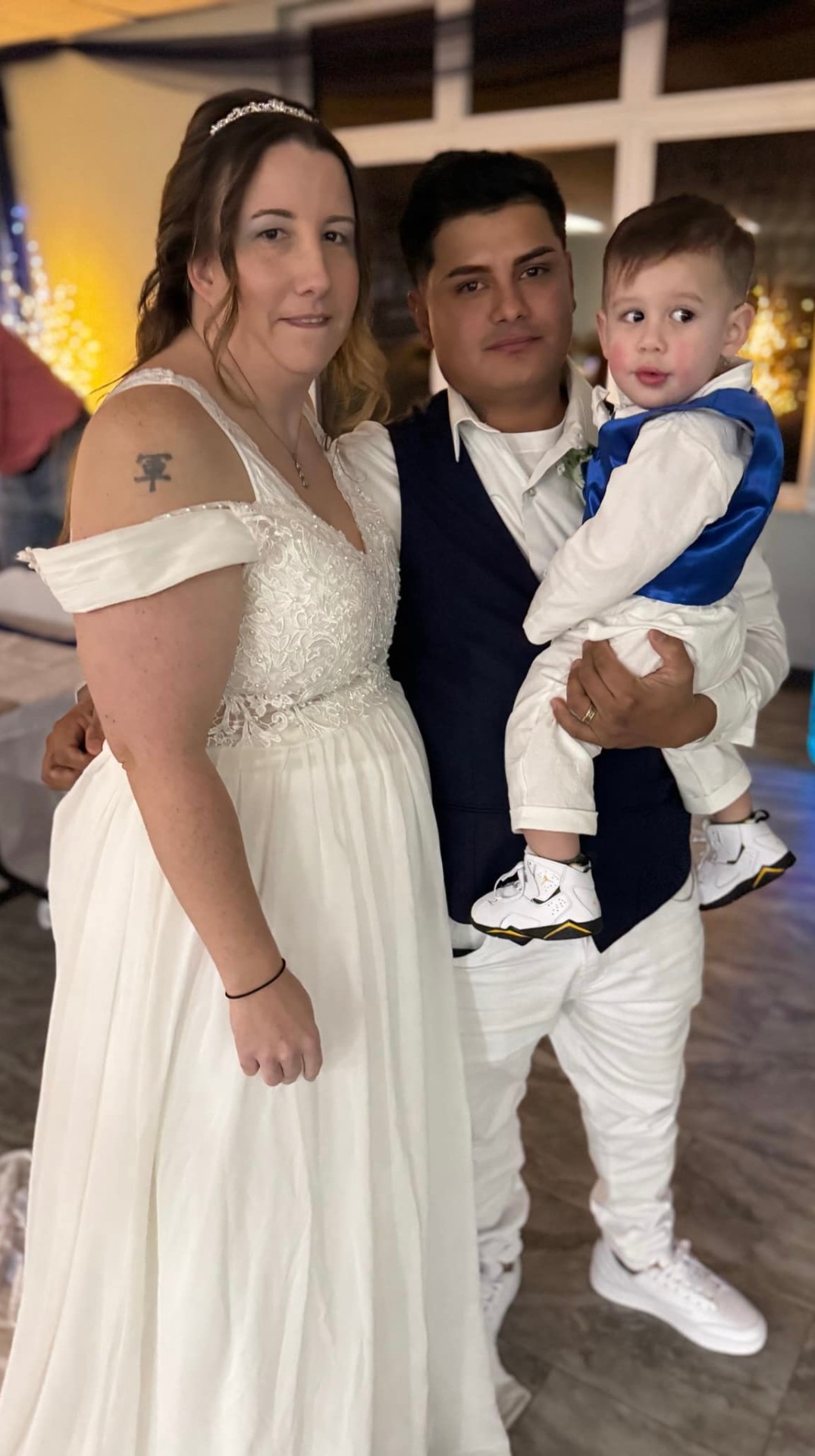 Emily Sappington and Gabriel Mendez, founders of E&G Siding, with their son